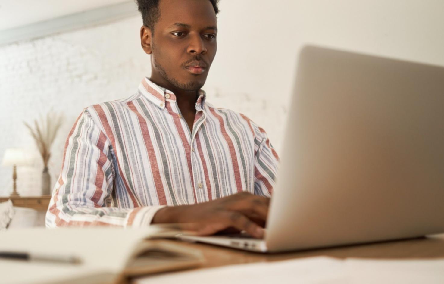 Financial planning workspace with notebooks and coffee